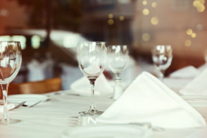 White restaurant table linens and napkins.