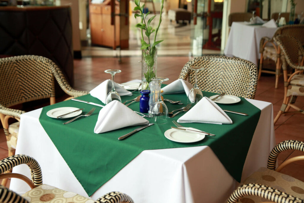 NJ Linen rental - green and white table linens in a restaurant